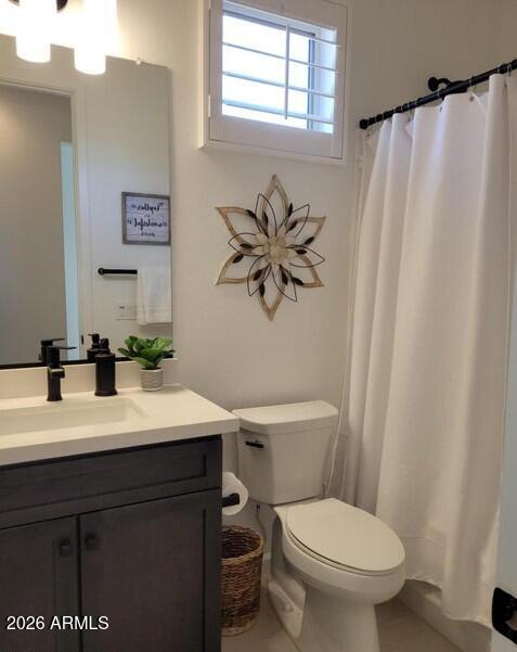4540 Jackpot Road Wickenburg, AZ 85390 - Photo 9 of 13 a bathroom with a sink mirror vanity and toilet