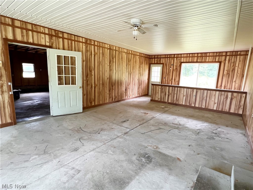 Breezeway with door to garage and door to backyard