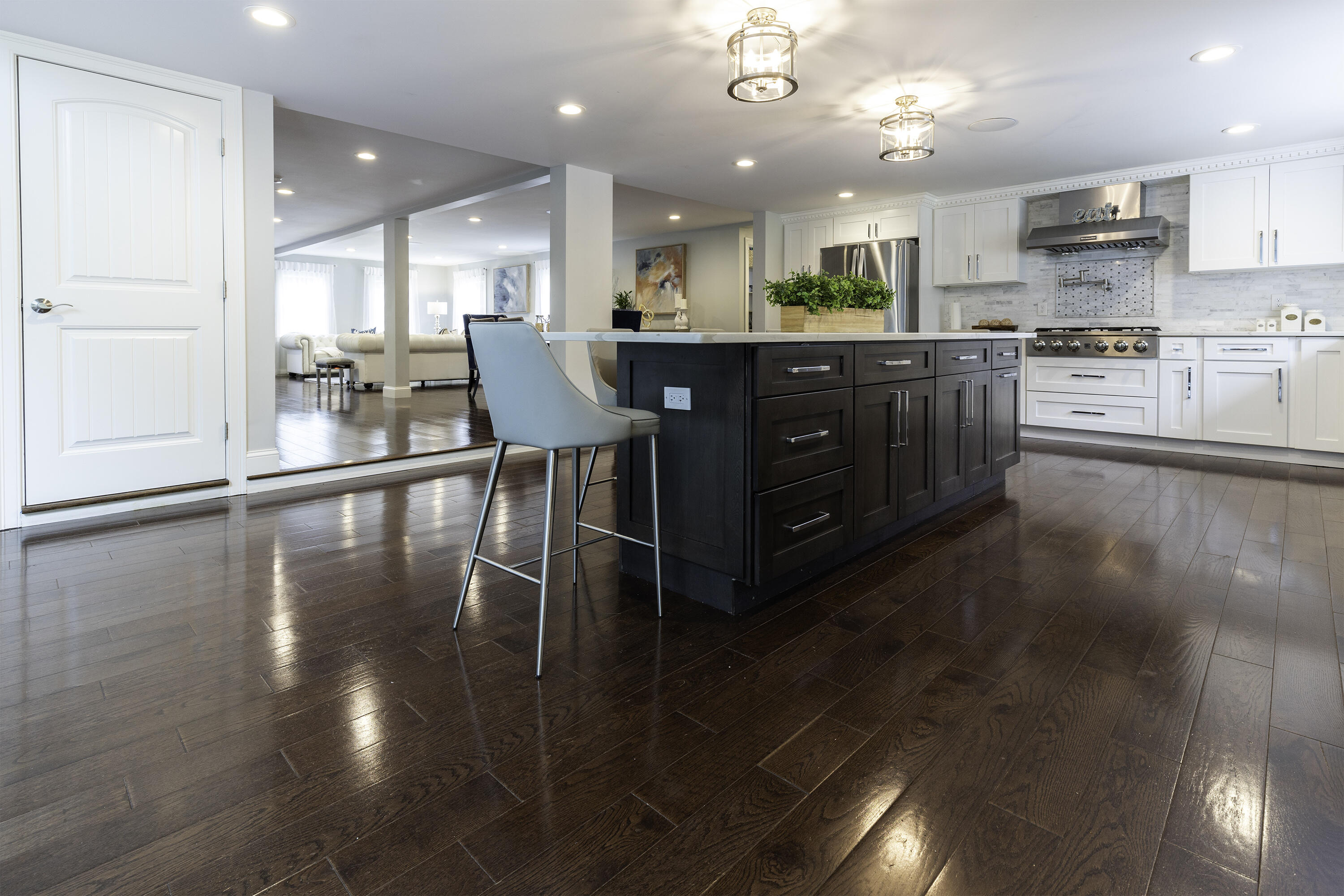 52 Boardley Road Sandwich, MA 02563 - Photo 24 of 100 a kitchen with stainless steel appliances a dining table chairs and stove