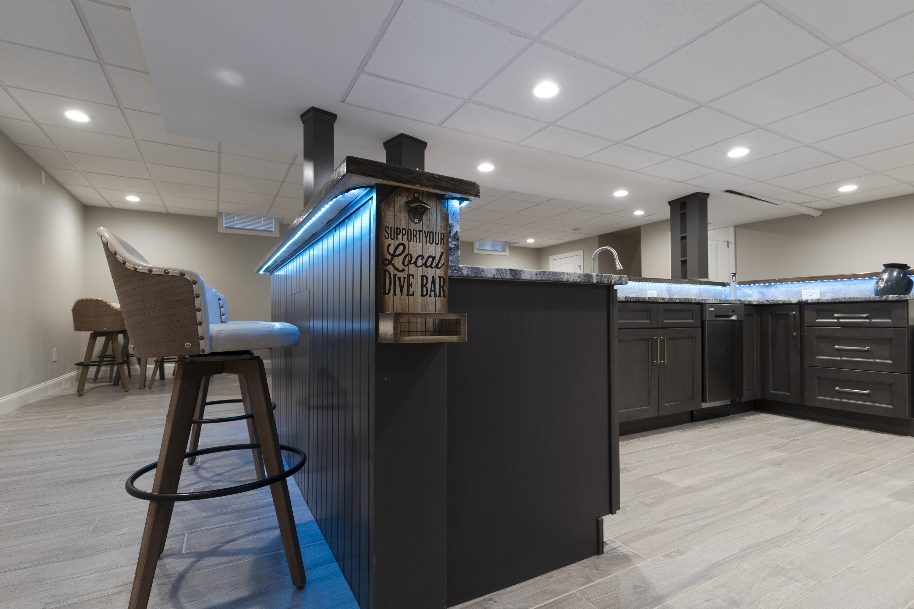 52 Boardley Road Sandwich, MA 02563 - Photo 43 of 100 a kitchen with stainless steel appliances kitchen island hardwood floor sink stove dining table and chairs