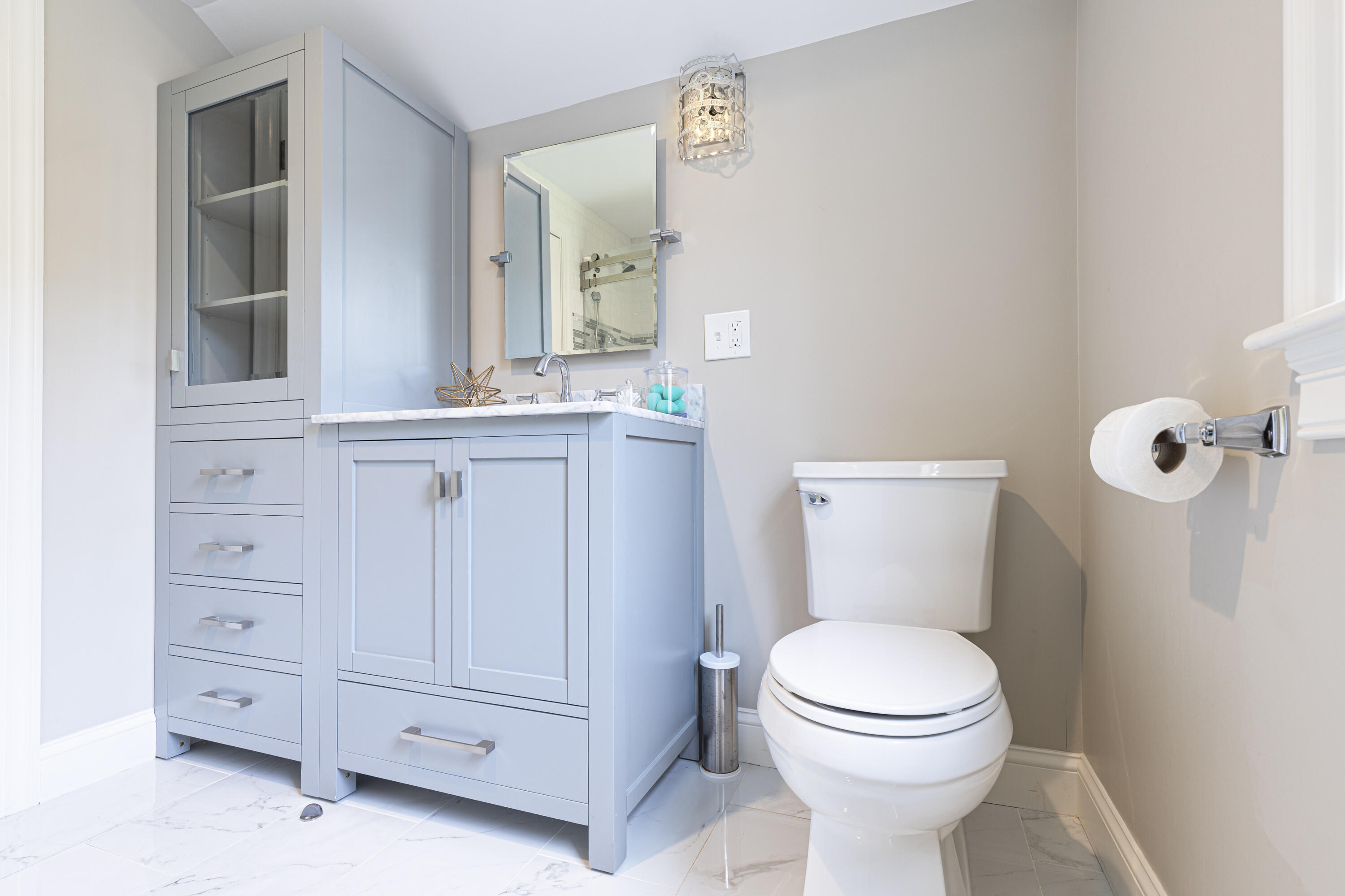 52 Boardley Road Sandwich, MA 02563 - Photo 64 of 100 a bathroom with a toilet a sink a vanity and mirror