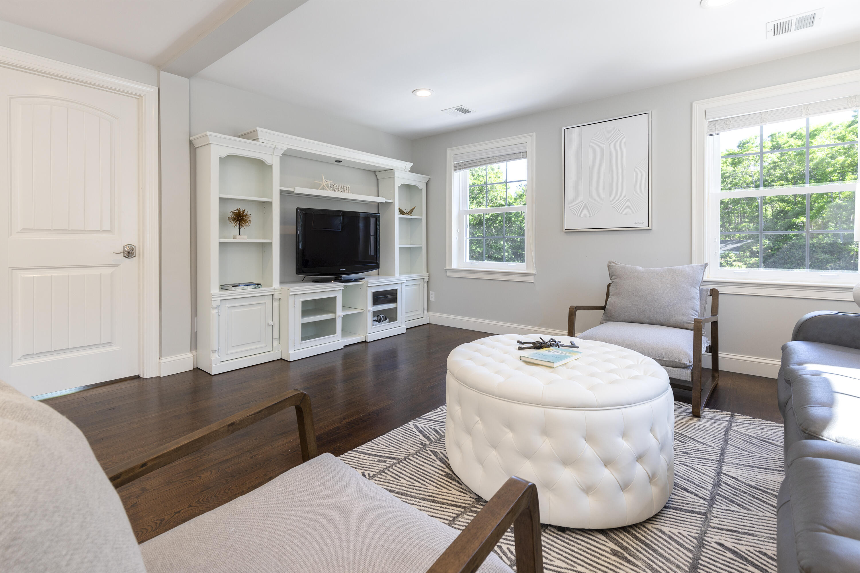 52 Boardley Road Sandwich, MA 02563 - Photo 68 of 100 a living room with furniture a flat screen tv and a large window