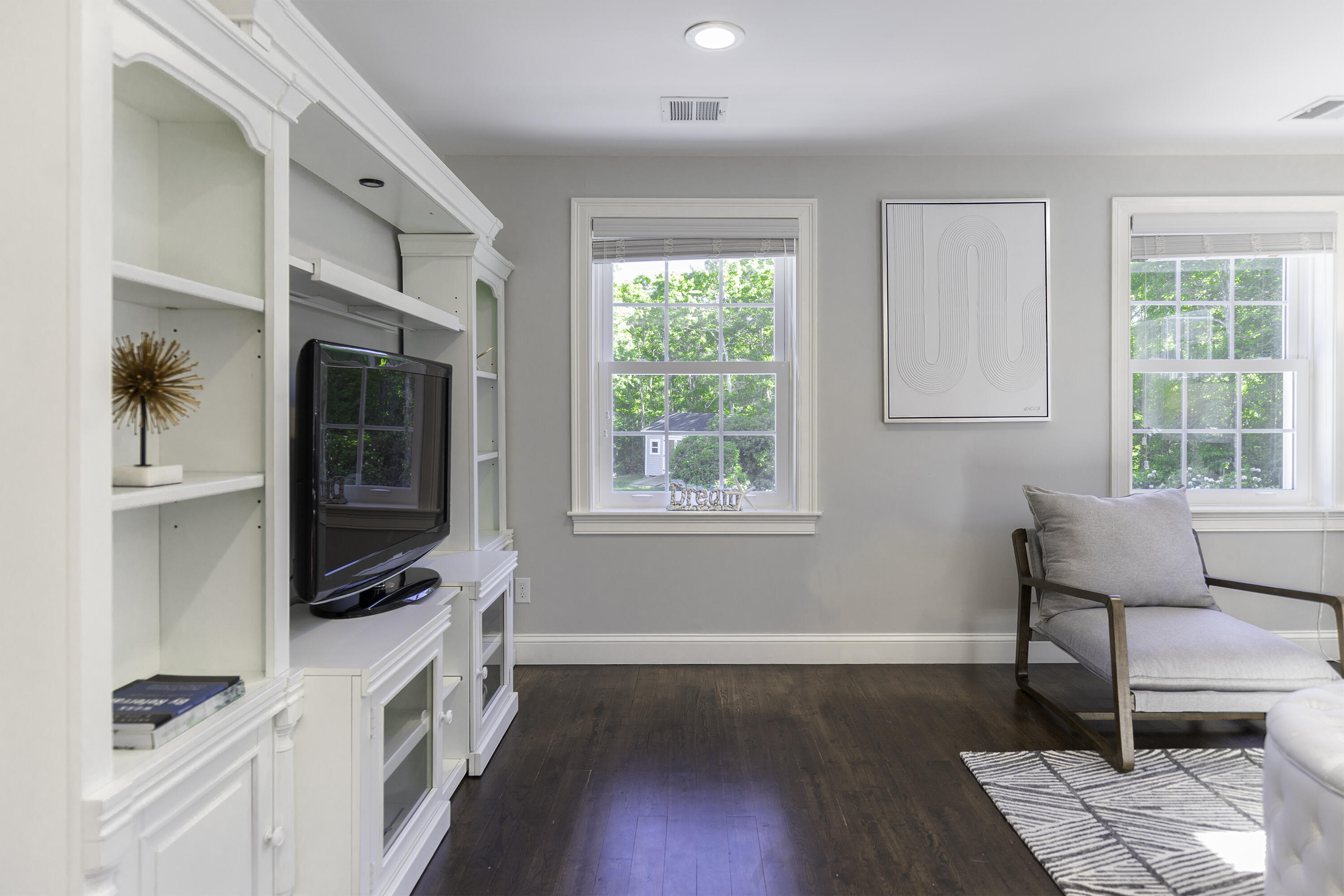 52 Boardley Road Sandwich, MA 02563 - Photo 69 of 100 a living room with furniture wooden floor and a window