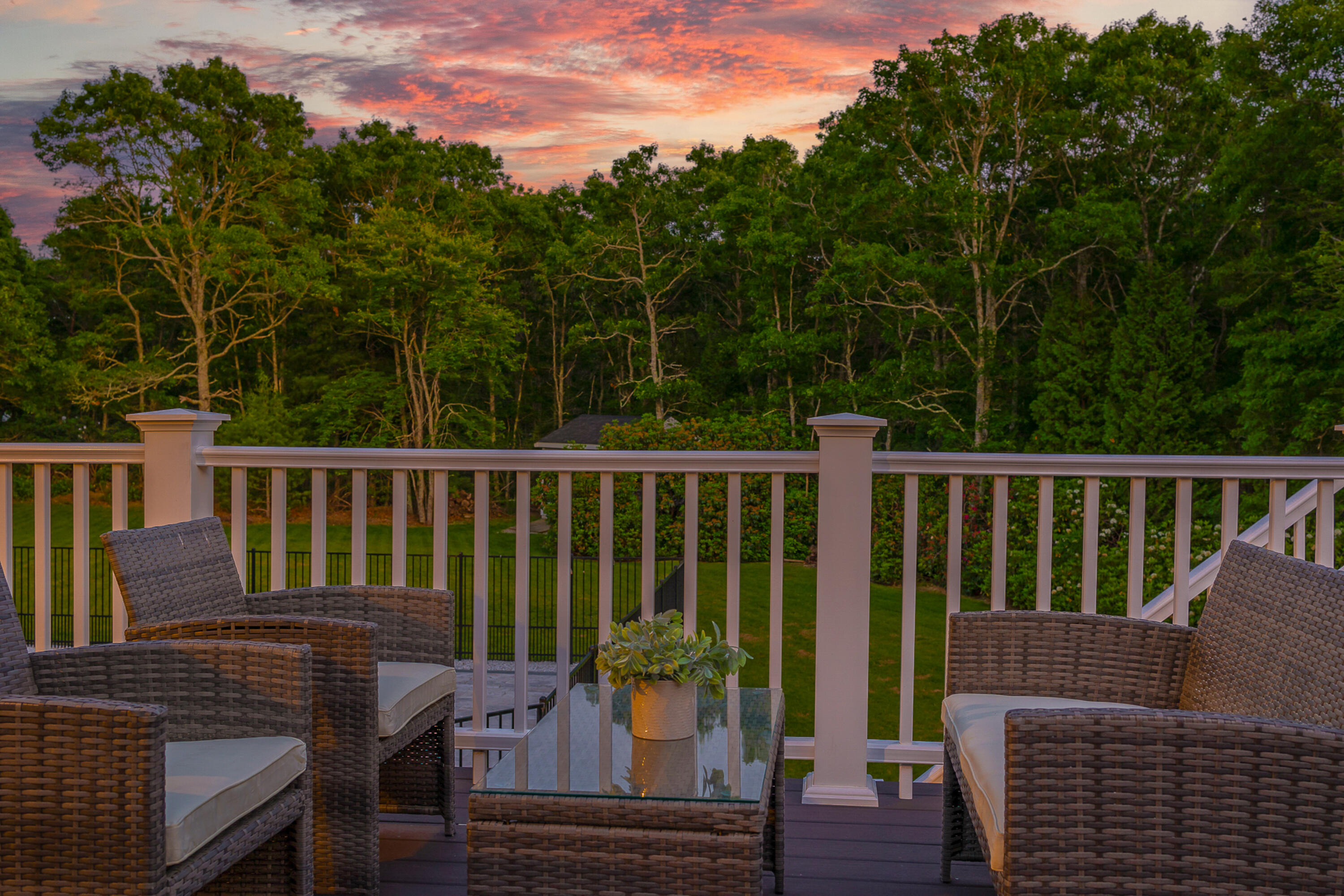 52 Boardley Road Sandwich, MA 02563 - Photo 73 of 100 a view of a deck with two chair and wooden floor