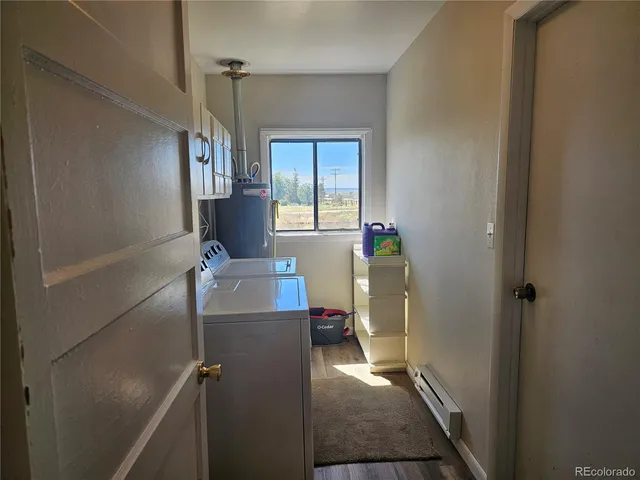 a view of a hallway with furniture and front door