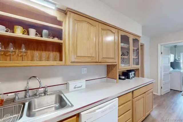 a kitchen with a sink and cabinets