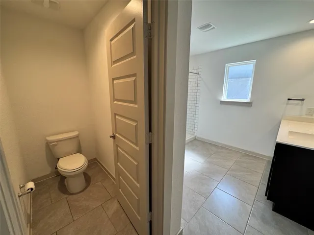 a bathroom with a toilet