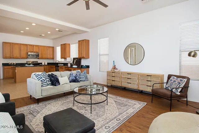 a living room with furniture and a rug