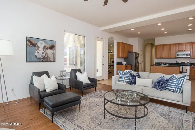 a living room with furniture and a large window