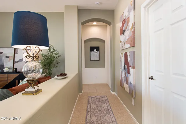 a en suite bathroom with a sink and a large mirror
