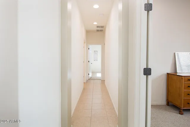 a view of a bathroom from a hallway