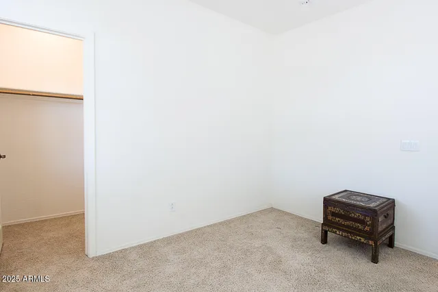 a room with a chair and a window