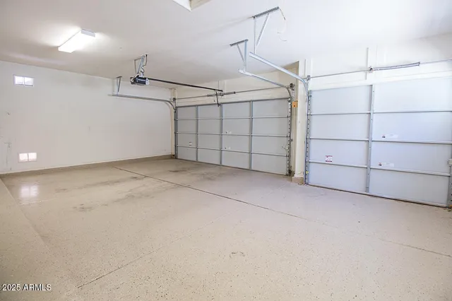 a front view of a house with a garden and yard