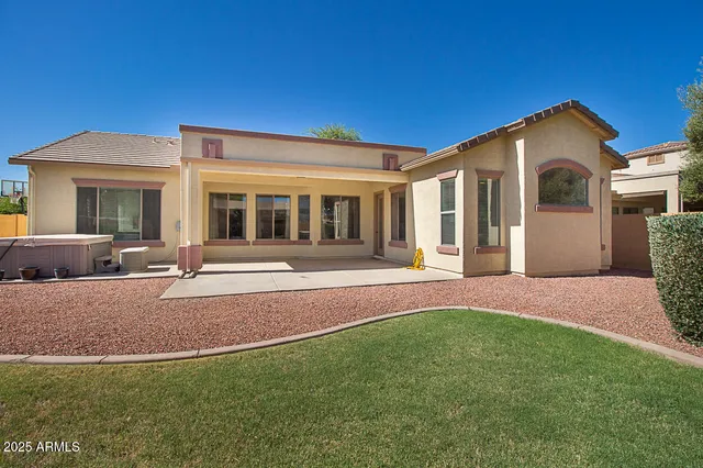 a view of a house with backyard and porch