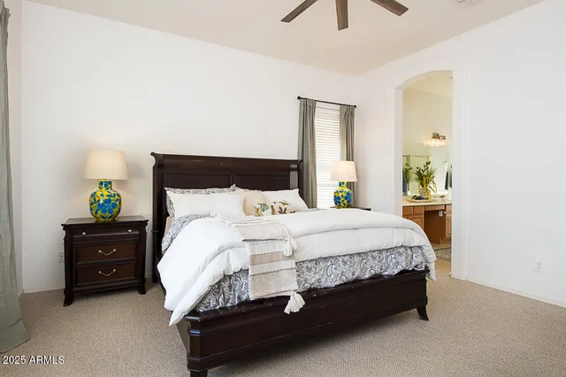 a bedroom with a bed dresser and a window