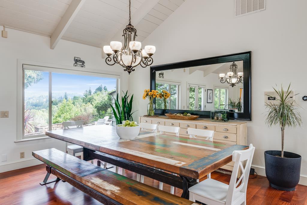 1501 Hidden Valley Road Soquel, CA 95073 - Photo 16 of 61 a view of a dining room with furniture a chandelier and wooden floor