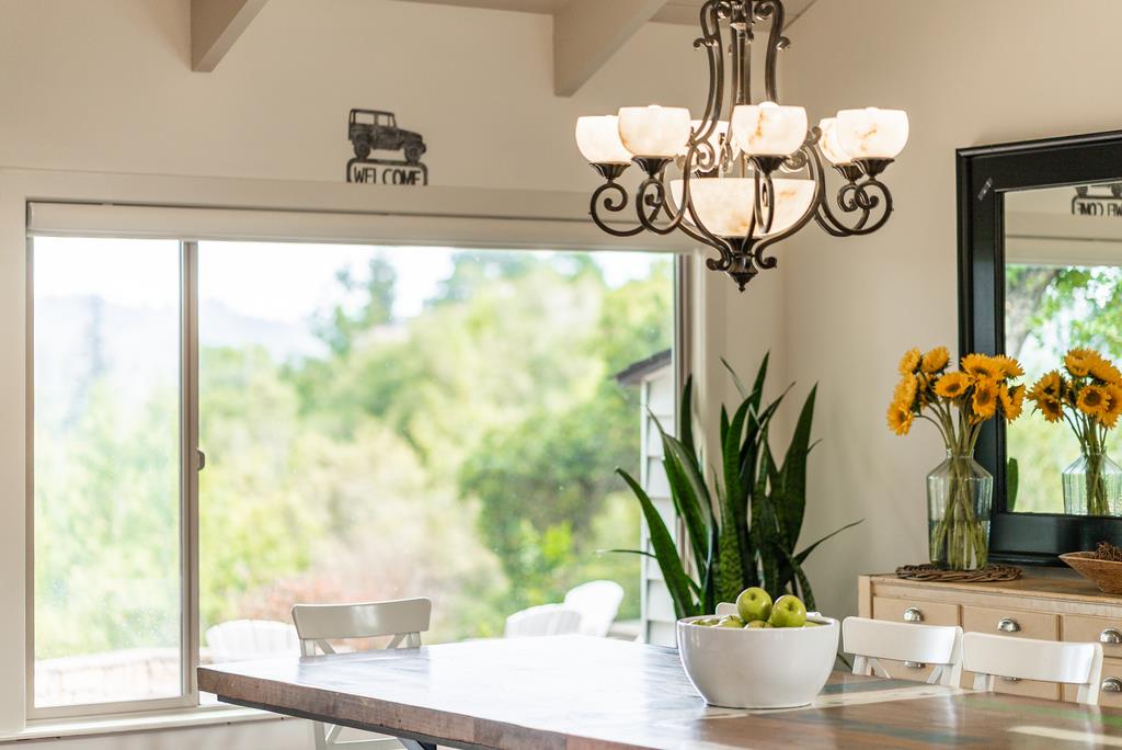 1501 Hidden Valley Road Soquel, CA 95073 - Photo 17 of 61 a vase of flowers sitting on a table with window