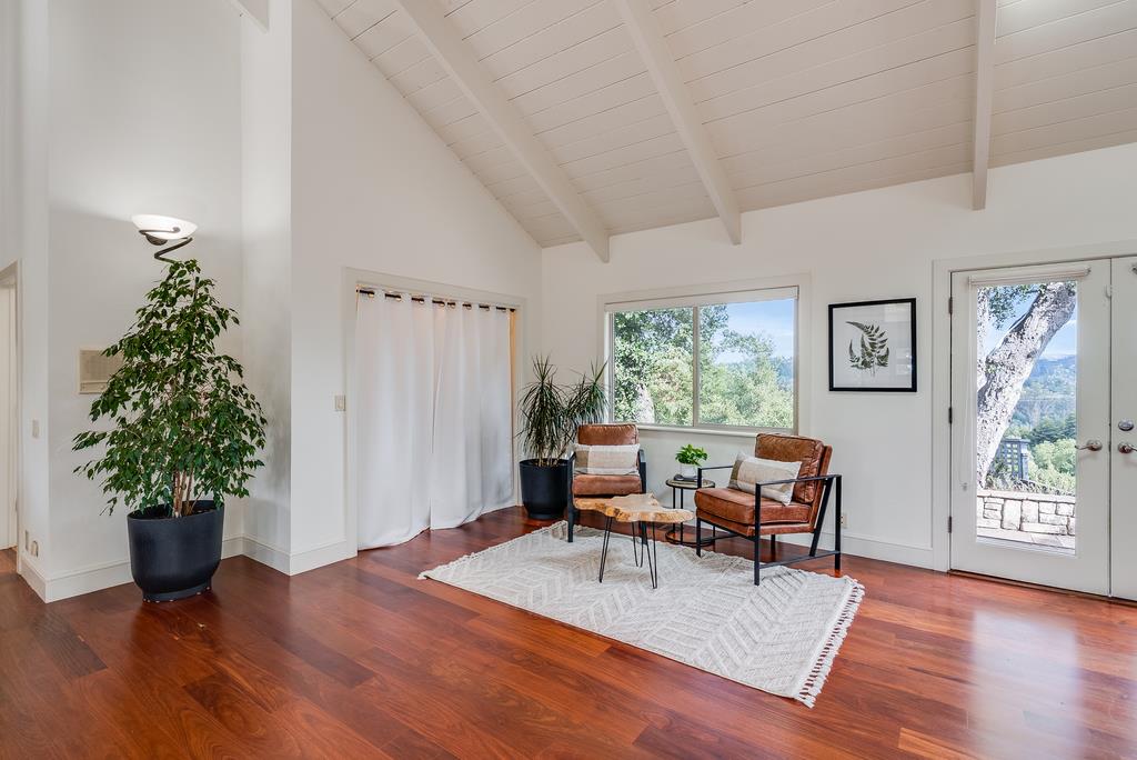 1501 Hidden Valley Road Soquel, CA 95073 - Photo 19 of 61 a living room with furniture a potted plant and a large window