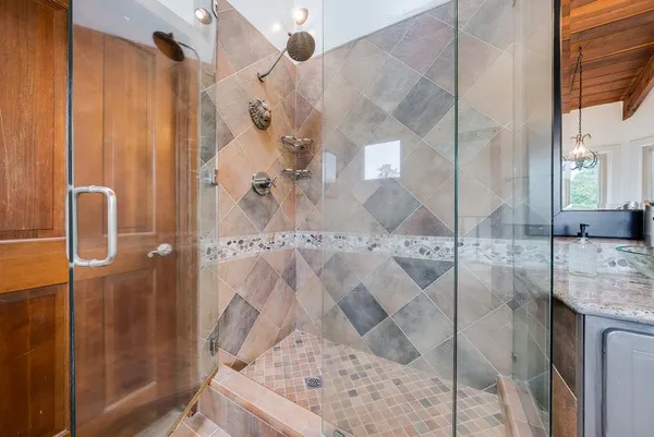 a view of a bathroom with sink and mirror