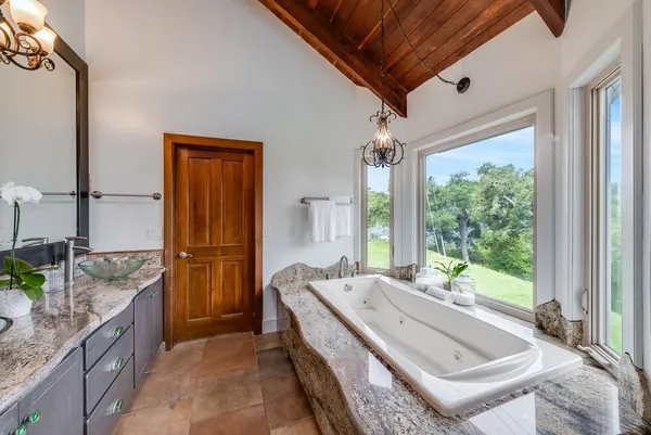 a bedroom with bed and a window