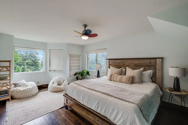 a bedroom with a bed and window