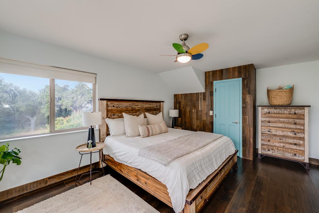 1501 Hidden Valley Road Soquel, CA 95073 - Photo 32 of 61 a bedroom with a bed and a window
