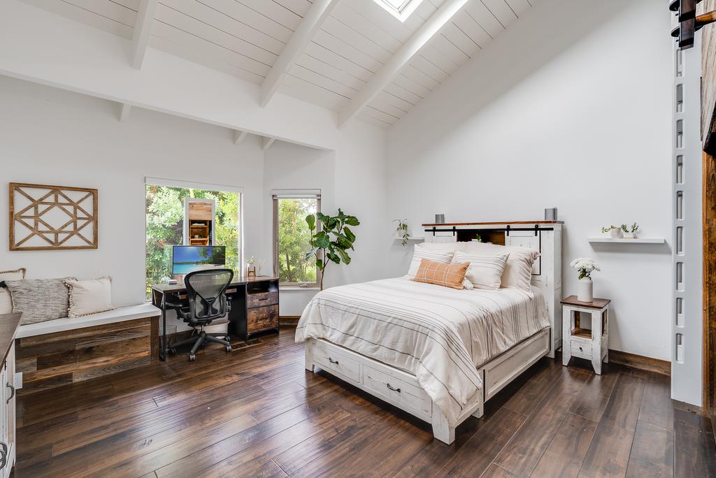 1501 Hidden Valley Road Soquel, CA 95073 - Photo 37 of 61 a bedroom with a bed and wooden floor