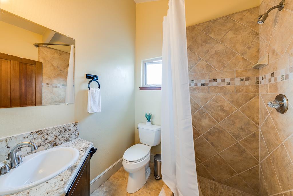 1501 Hidden Valley Road Soquel, CA 95073 - Photo 48 of 61 a bathroom with a sink toilet and shower