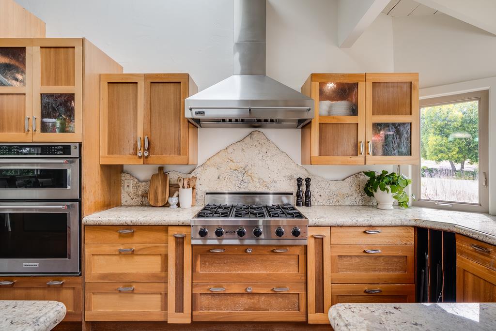1501 Hidden Valley Road Soquel, CA 95073 - Photo 8 of 61 a kitchen with stainless steel appliances granite countertop a stove and a refrigerator