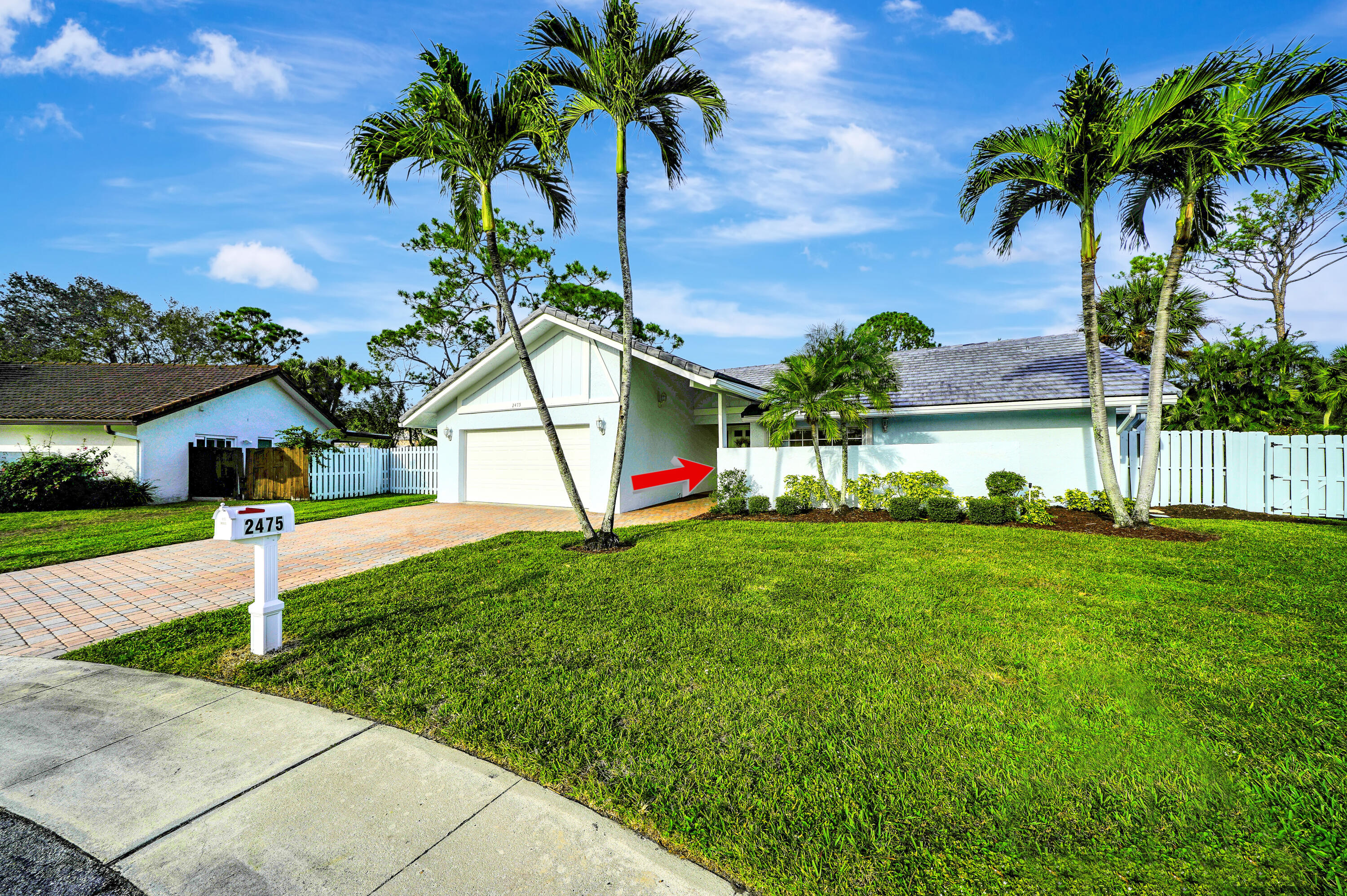2475 Northwest 25th Street Boca Raton, FL 33431 - Photo 16 of 72 a view of a house with a yard and palm tree