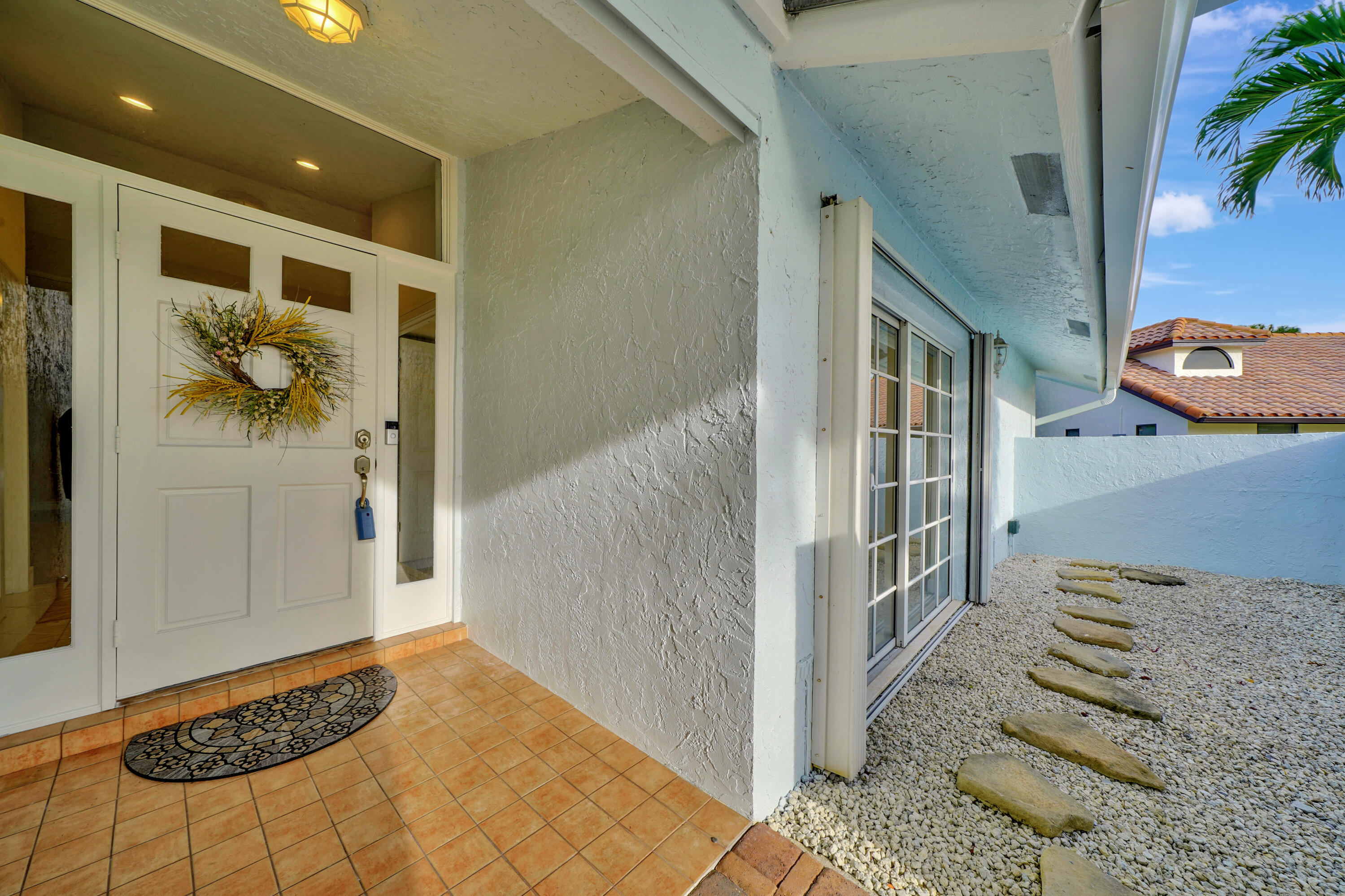 2475 Northwest 25th Street Boca Raton, FL 33431 - Photo 18 of 72 a view of entryway with furniture and rug