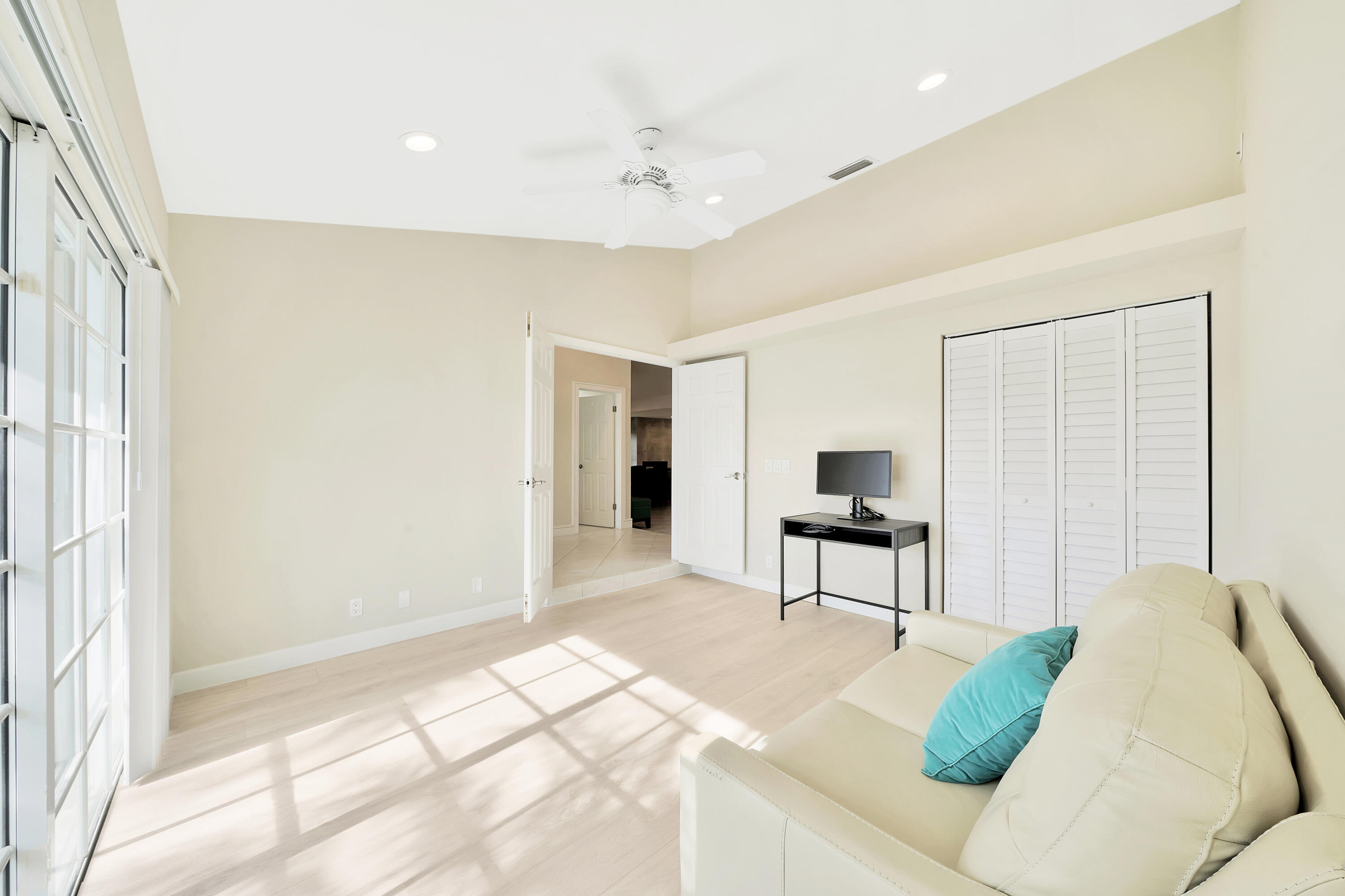 2475 Northwest 25th Street Boca Raton, FL 33431 - Photo 24 of 72 a living room with furniture and a window