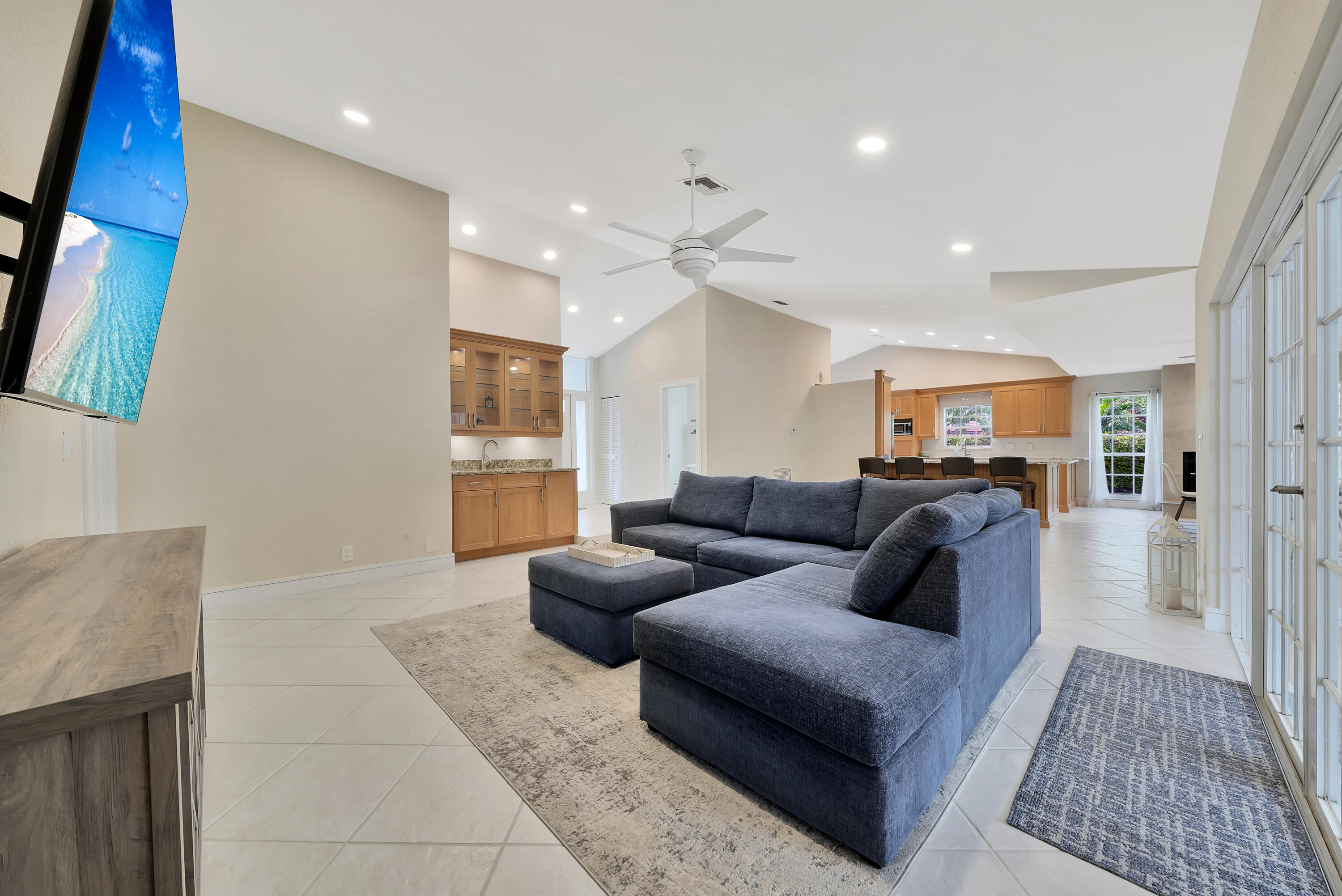 2475 Northwest 25th Street Boca Raton, FL 33431 - Photo 28 of 72 a living room with furniture and a rug