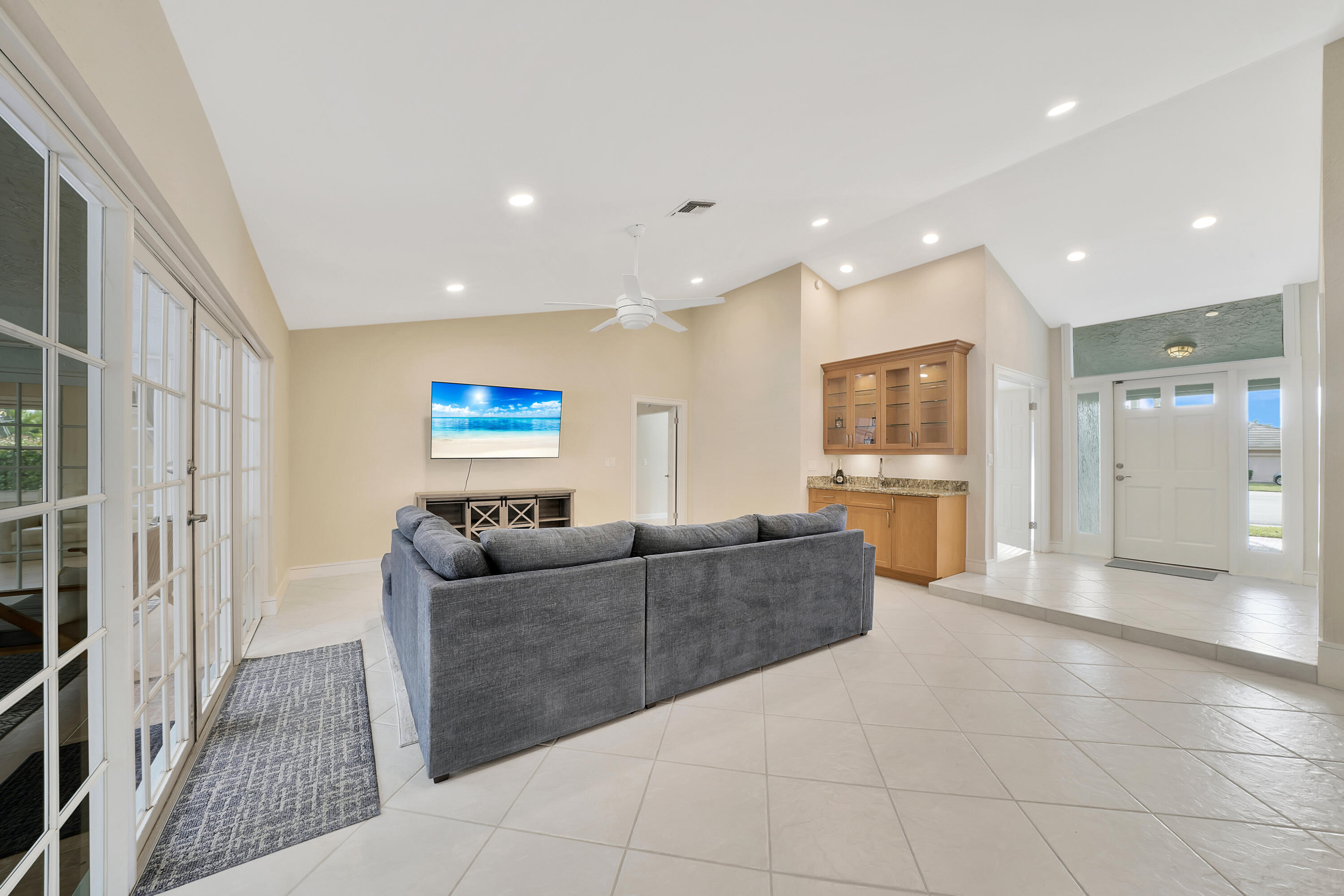 2475 Northwest 25th Street Boca Raton, FL 33431 - Photo 30 of 72 a living room with furniture and kitchen view