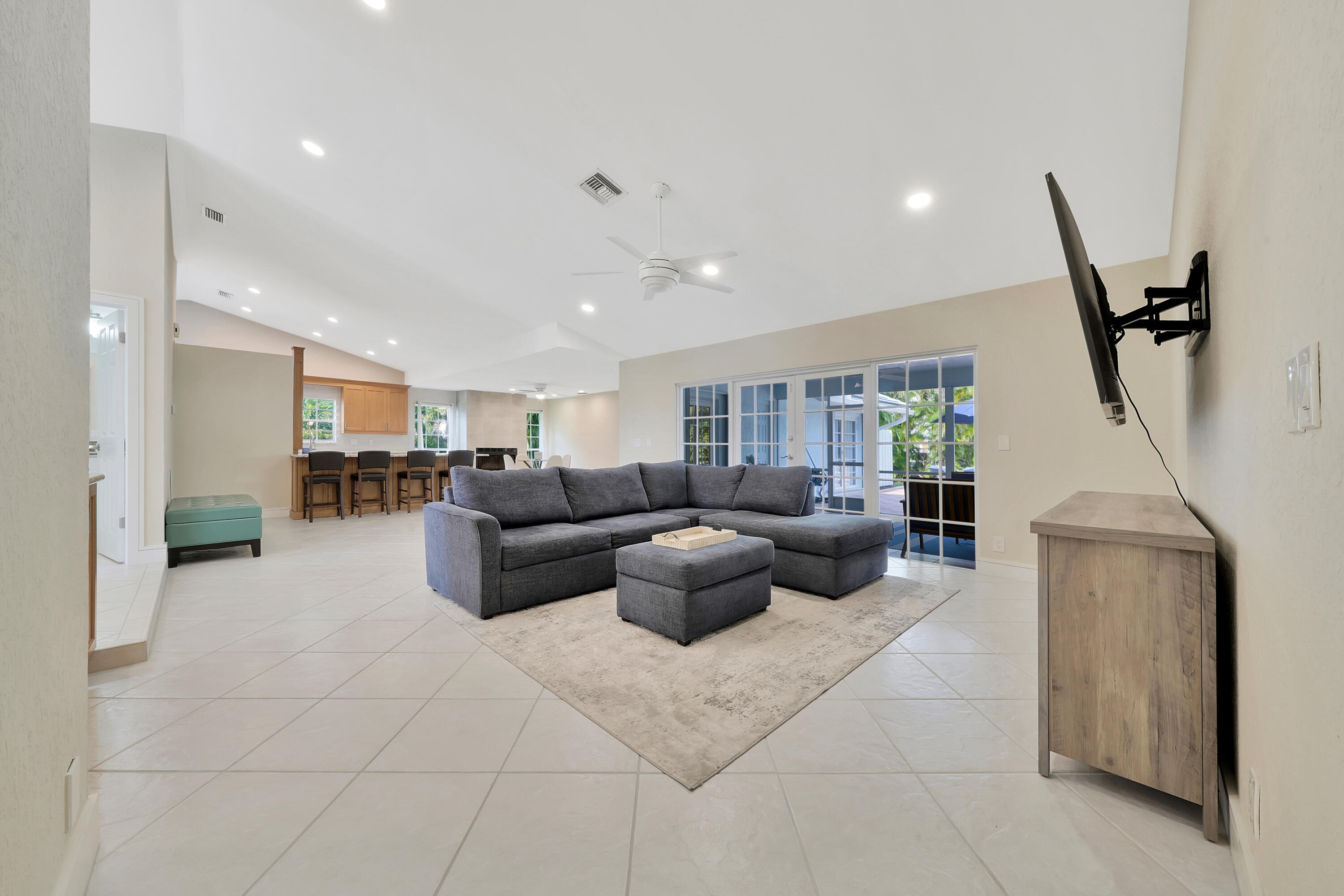 2475 Northwest 25th Street Boca Raton, FL 33431 - Photo 32 of 72 a living room with furniture and a rug