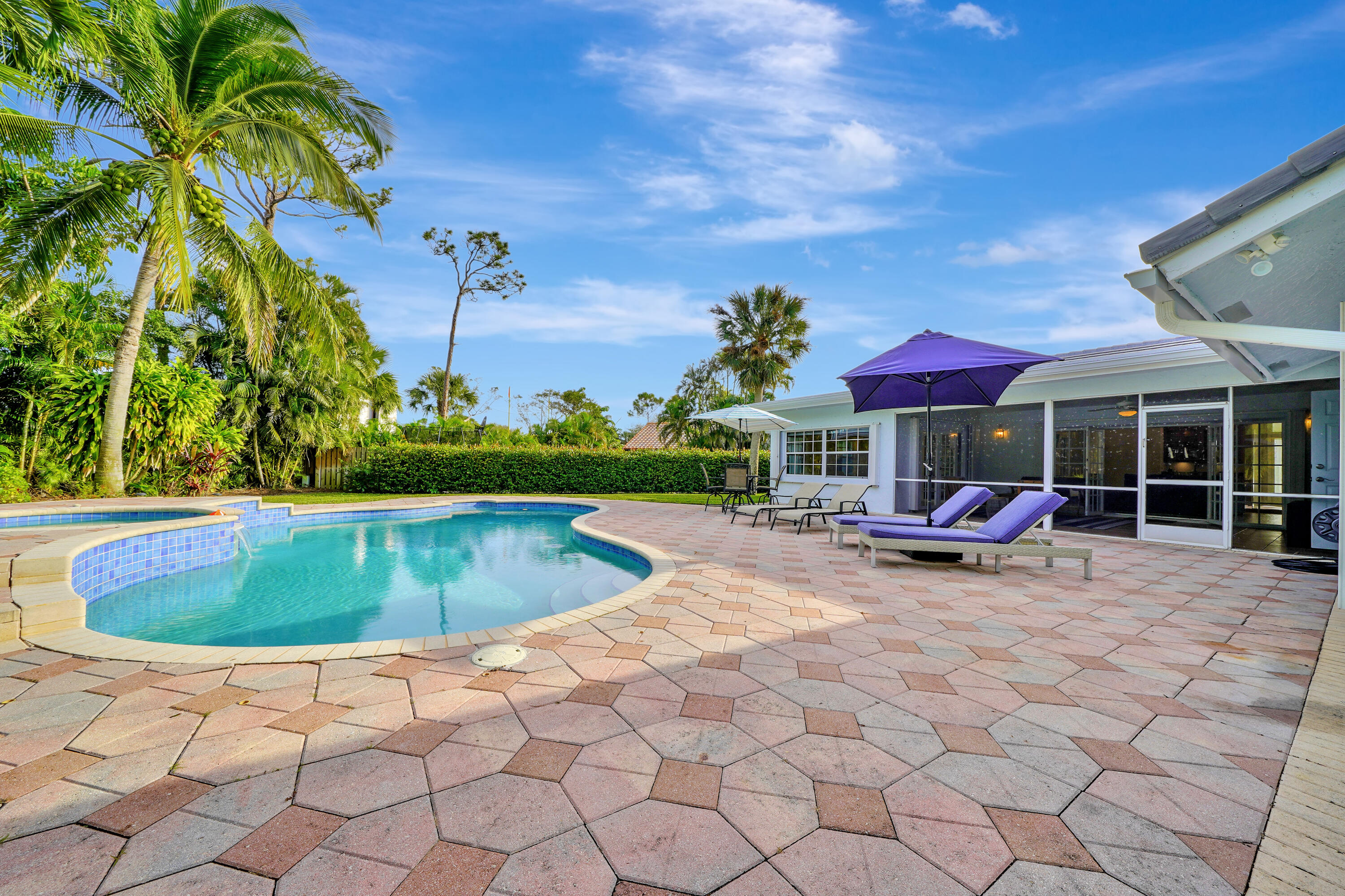 2475 Northwest 25th Street Boca Raton, FL 33431 - Photo 4 of 72 a view of a swimming pool with sitting area