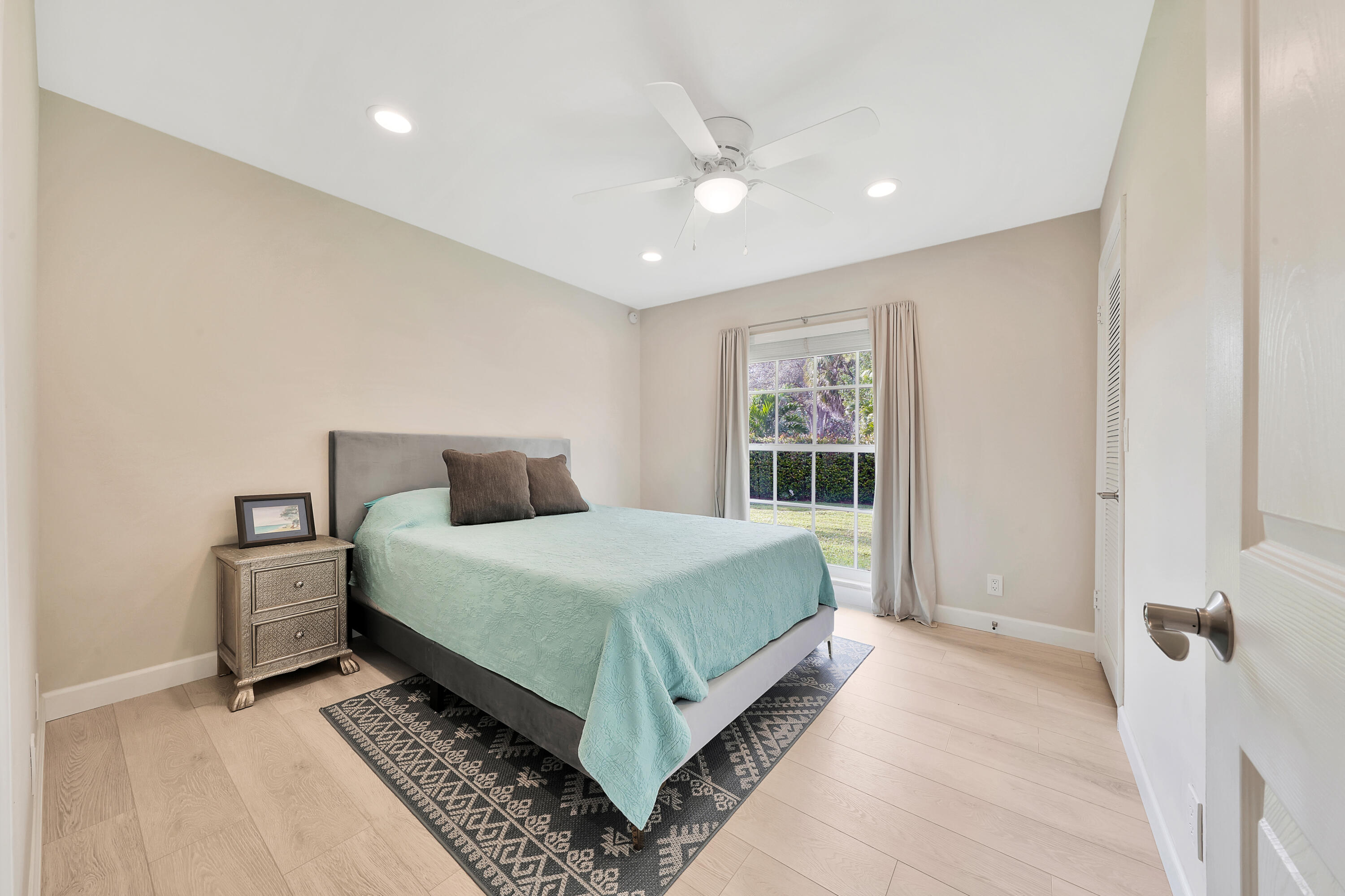 2475 Northwest 25th Street Boca Raton, FL 33431 - Photo 41 of 72 a bedroom with a bed and window
