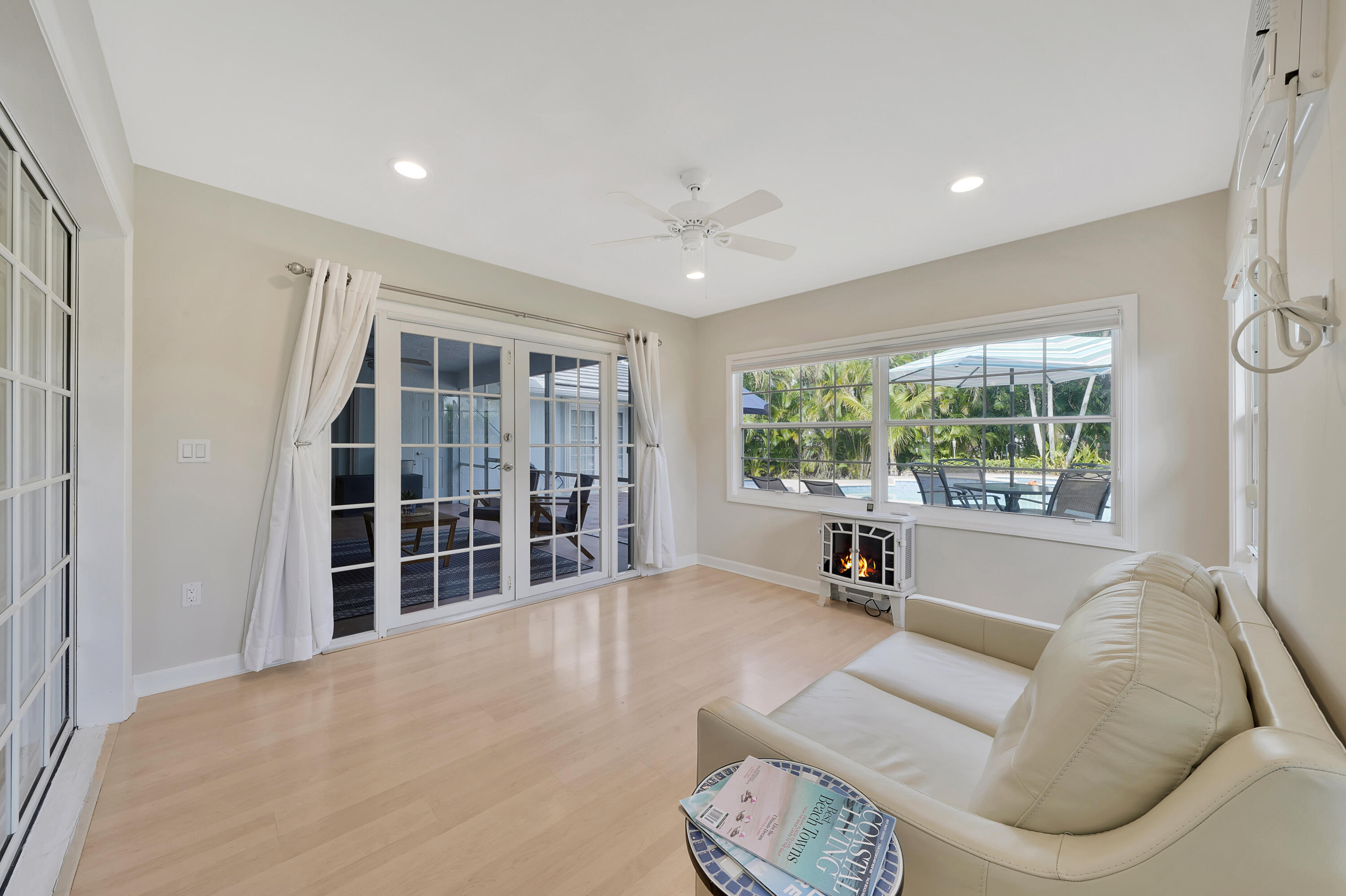 2475 Northwest 25th Street Boca Raton, FL 33431 - Photo 52 of 72 a living room with furniture and a large window