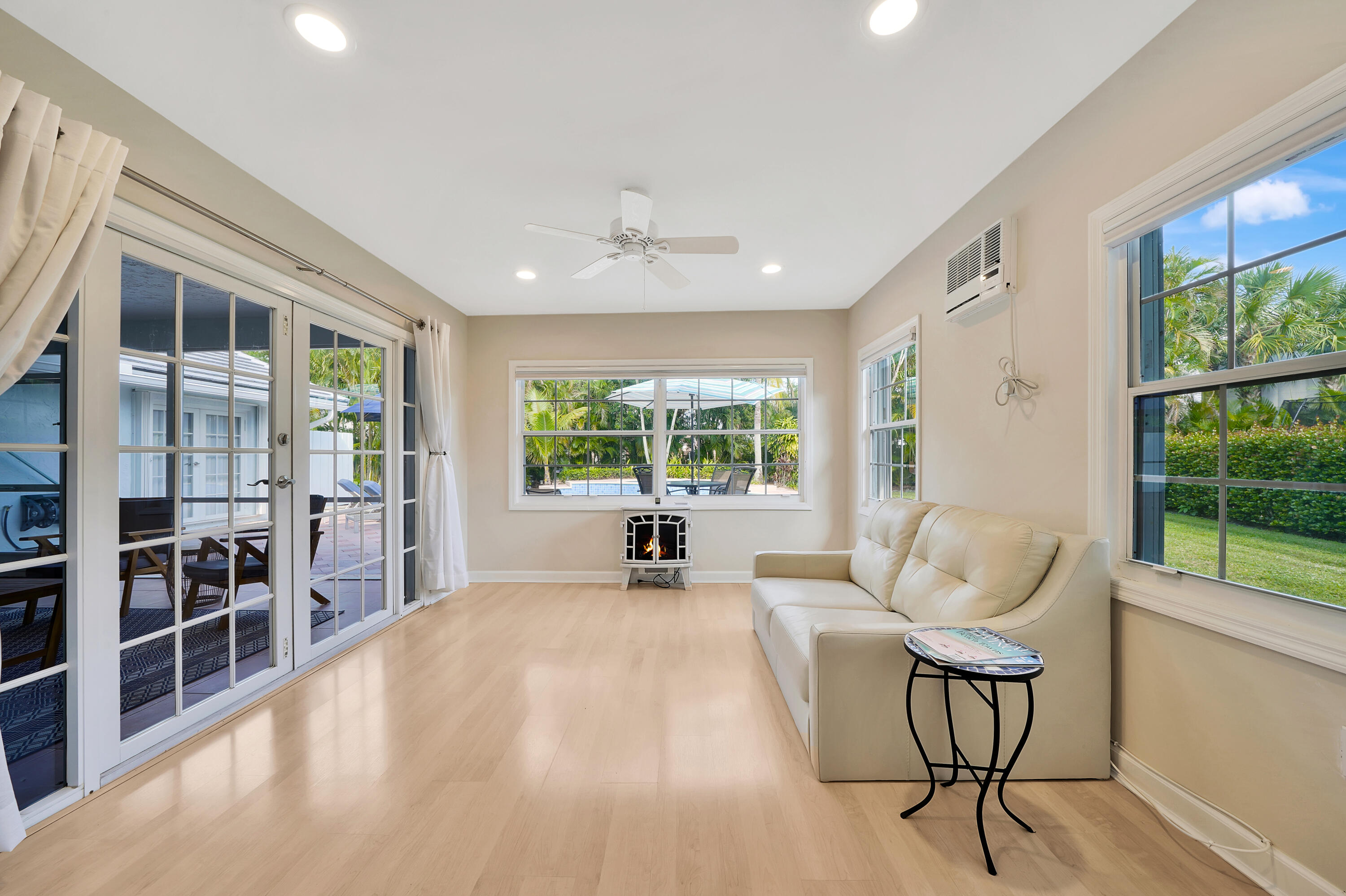 2475 Northwest 25th Street Boca Raton, FL 33431 - Photo 53 of 72 a spacious bedroom with a large window and a table