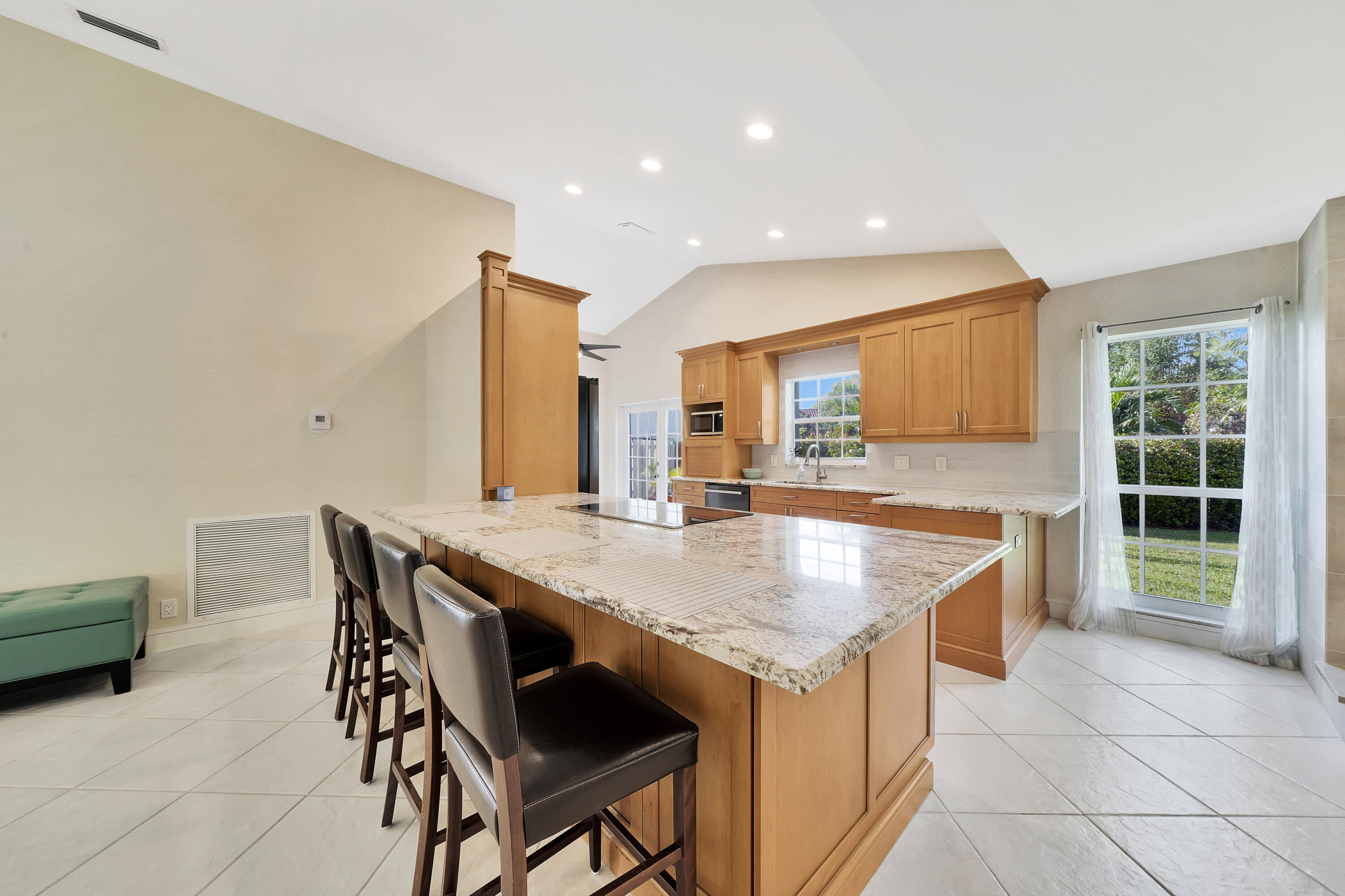 2475 Northwest 25th Street Boca Raton, FL 33431 - Photo 6 of 72 a kitchen with a table and chairs in it