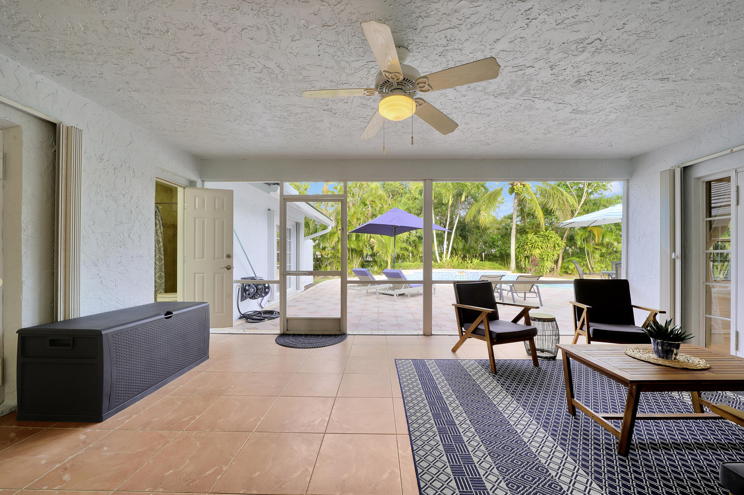 2475 Northwest 25th Street Boca Raton, FL 33431 - Photo 61 of 72 a living room with furniture and a large window