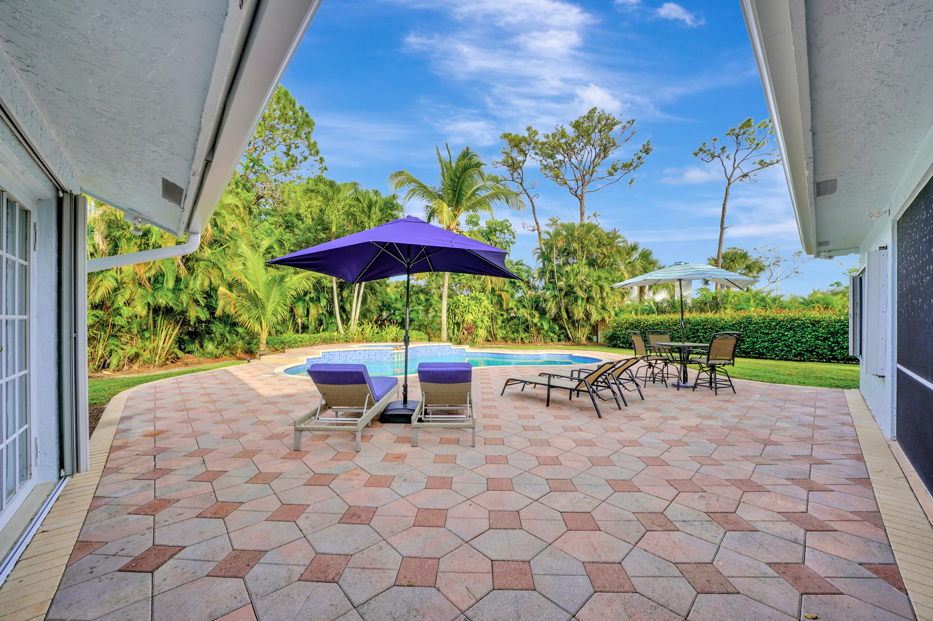 2475 Northwest 25th Street Boca Raton, FL 33431 - Photo 63 of 72 a view of a patio with chairs and potted plants