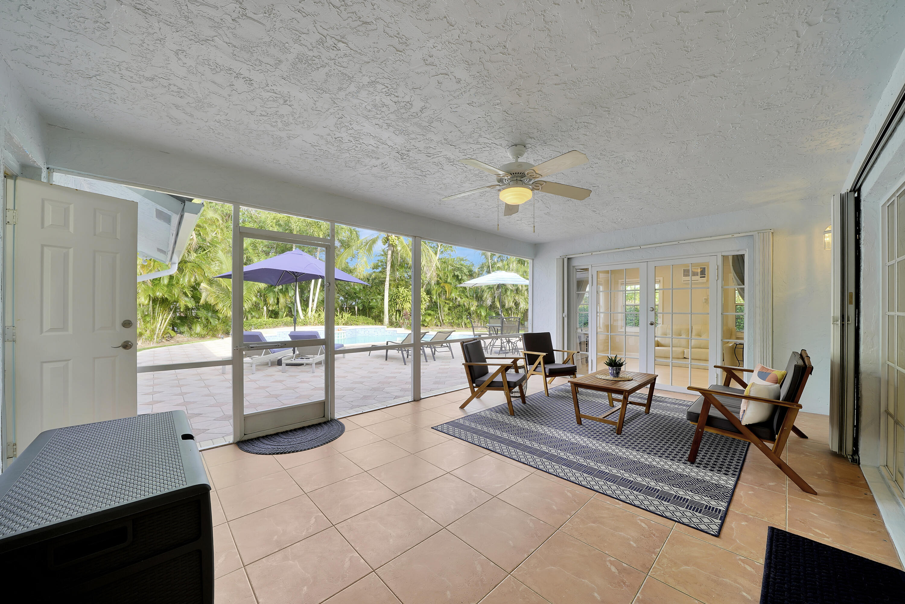 2475 Northwest 25th Street Boca Raton, FL 33431 - Photo 64 of 72 a living room with furniture and a large window