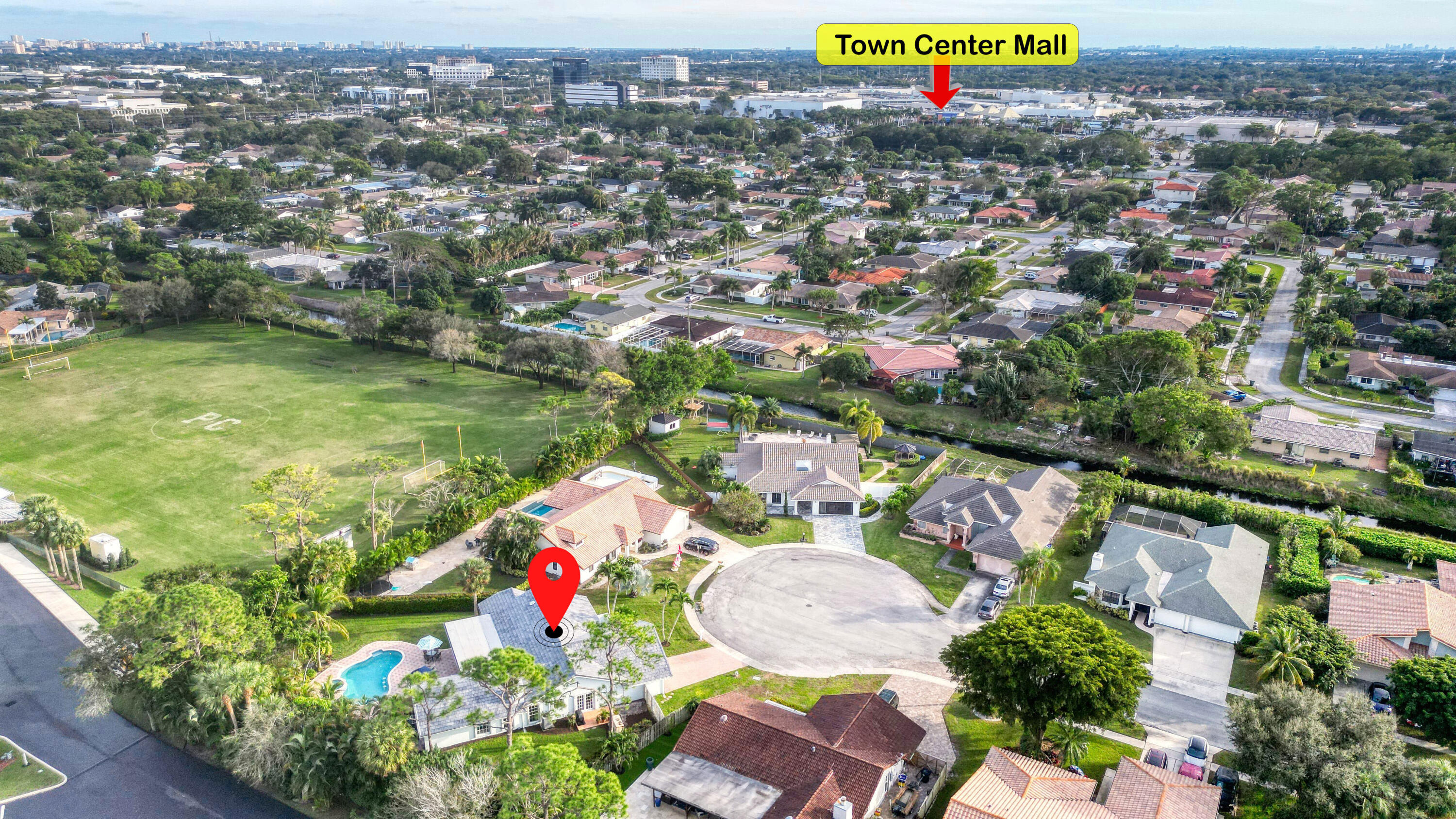 2475 Northwest 25th Street Boca Raton, FL 33431 - Photo 71 of 72 an aerial view of residential houses with outdoor space and swimming pool