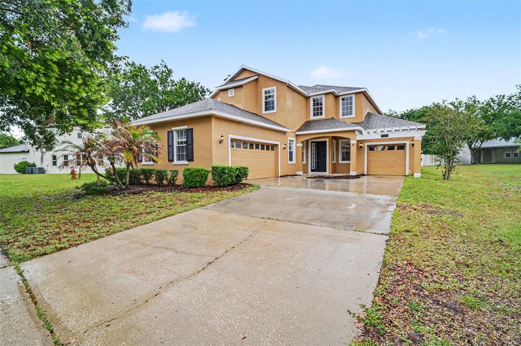4819 Indian Deer Road Windermere, FL 34786 - Photo 2 of 30 front view of a house with a yard
