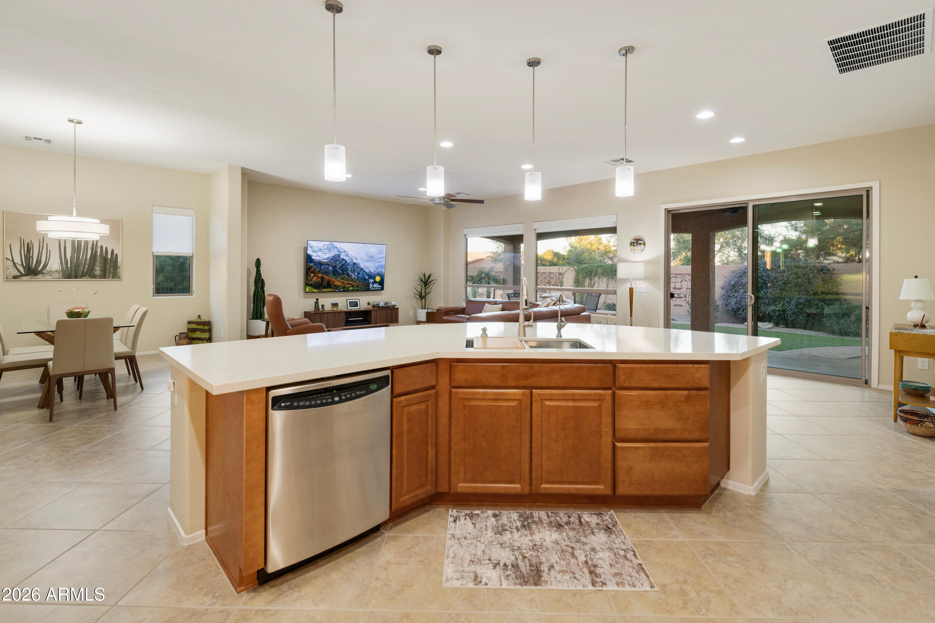 5291 South Sugarberry Court Gilbert, AZ 85298 - Photo 15 of 67 a kitchen with stainless steel appliances granite countertop a sink a stove and a wooden cabinets
