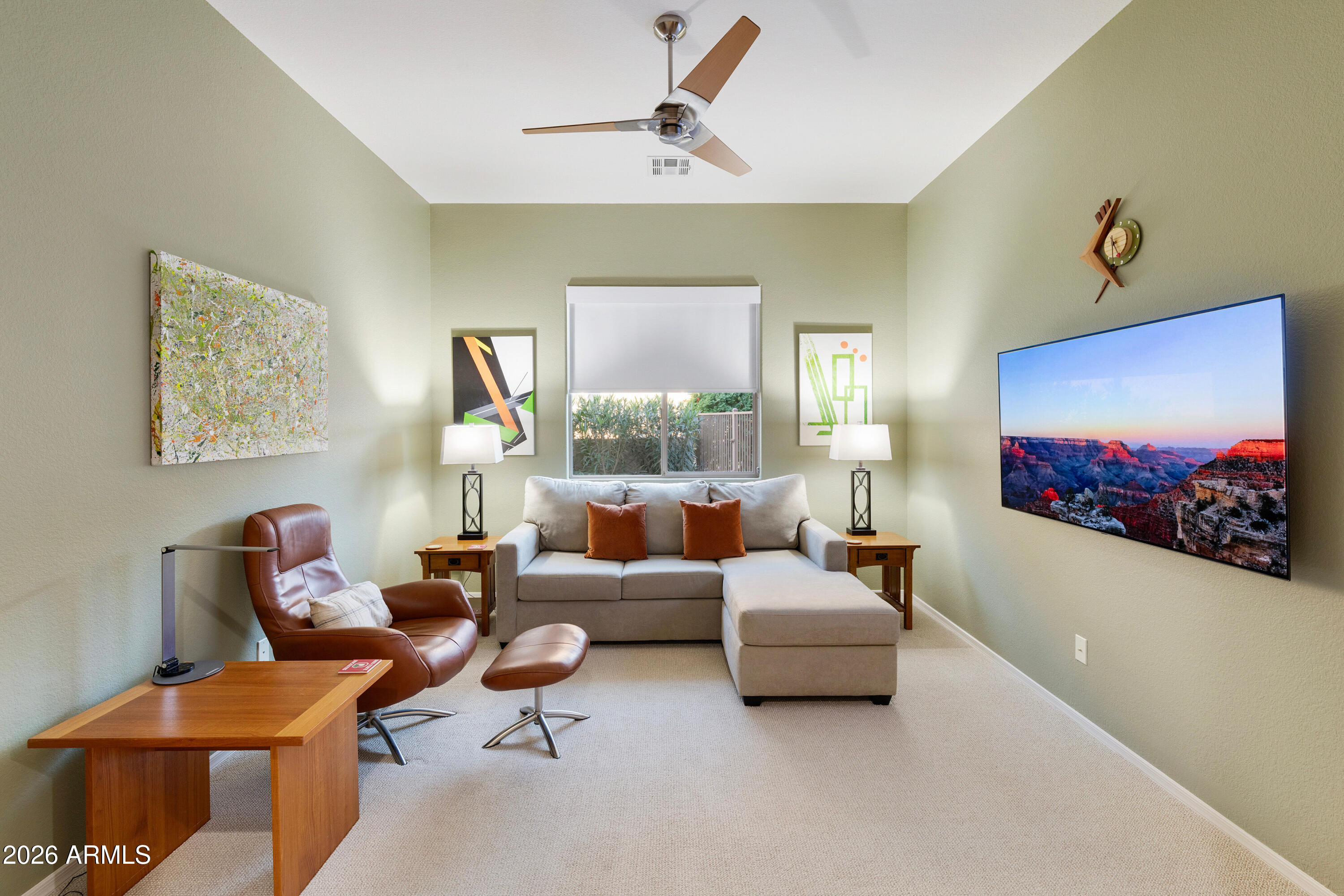 5291 South Sugarberry Court Gilbert, AZ 85298 - Photo 16 of 67 a living room with furniture and a flat screen tv