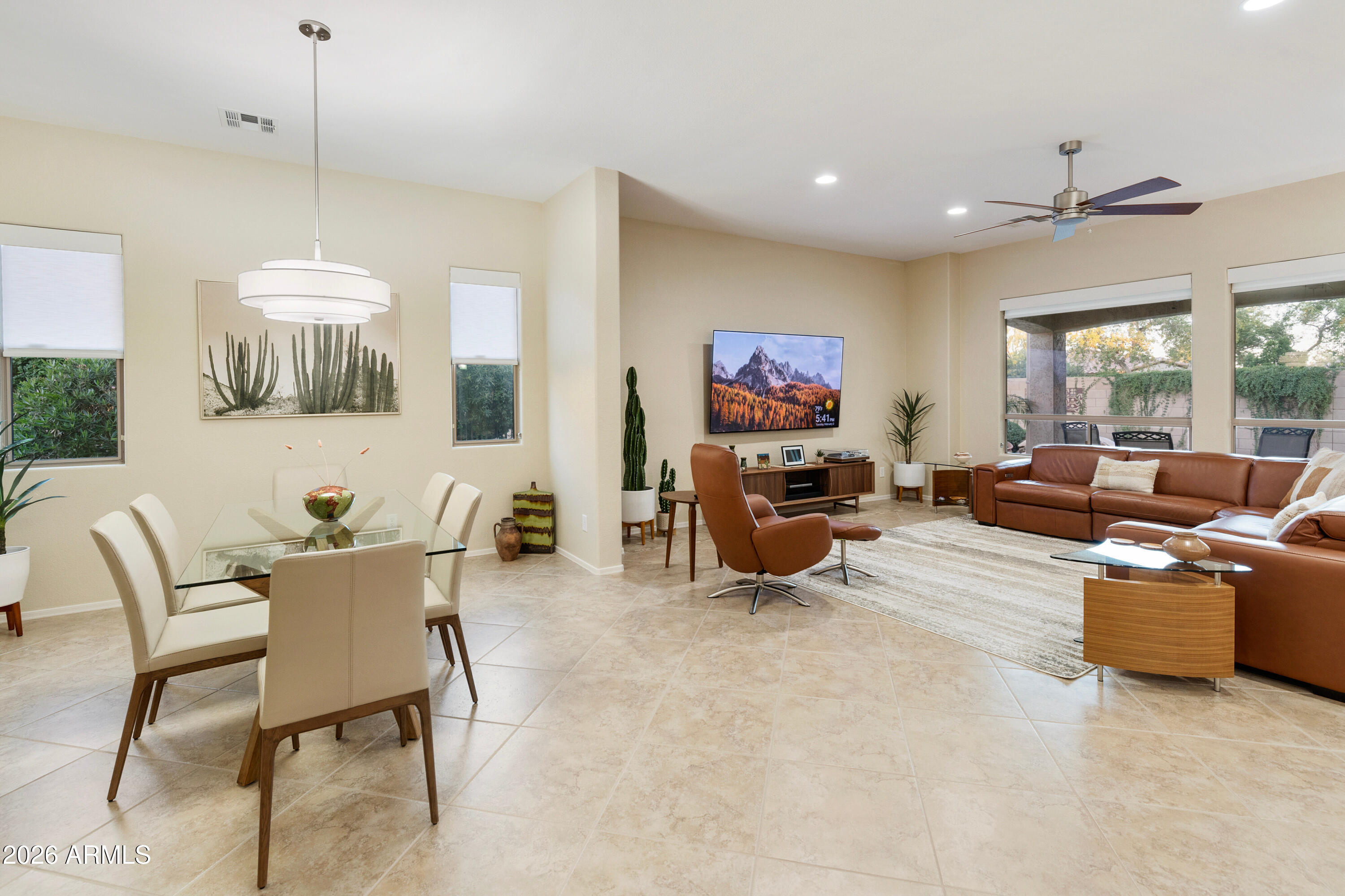 5291 South Sugarberry Court Gilbert, AZ 85298 - Photo 17 of 67 a living room with furniture and a chandelier