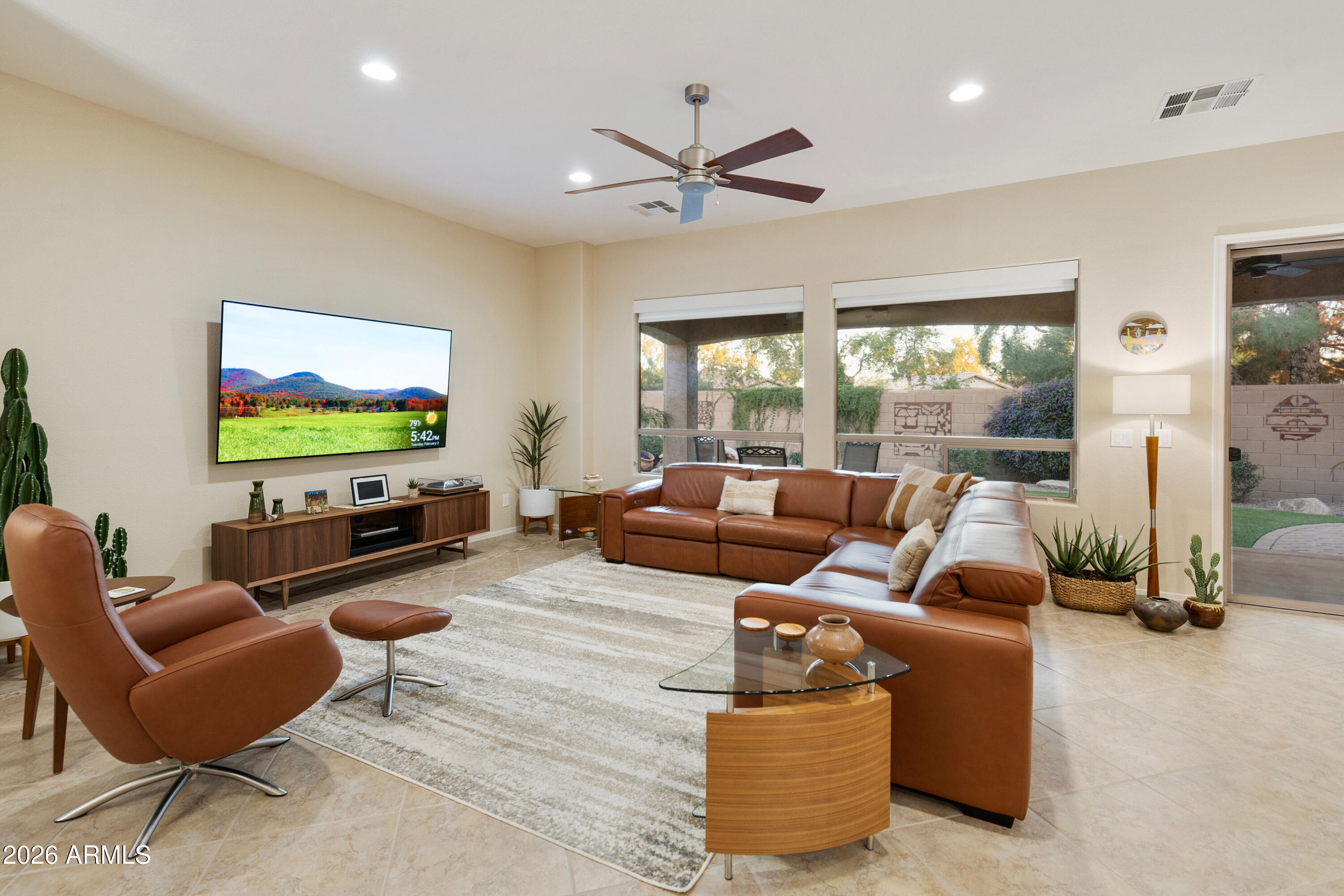 5291 South Sugarberry Court Gilbert, AZ 85298 - Photo 18 of 67 a living room with furniture and a flat screen tv