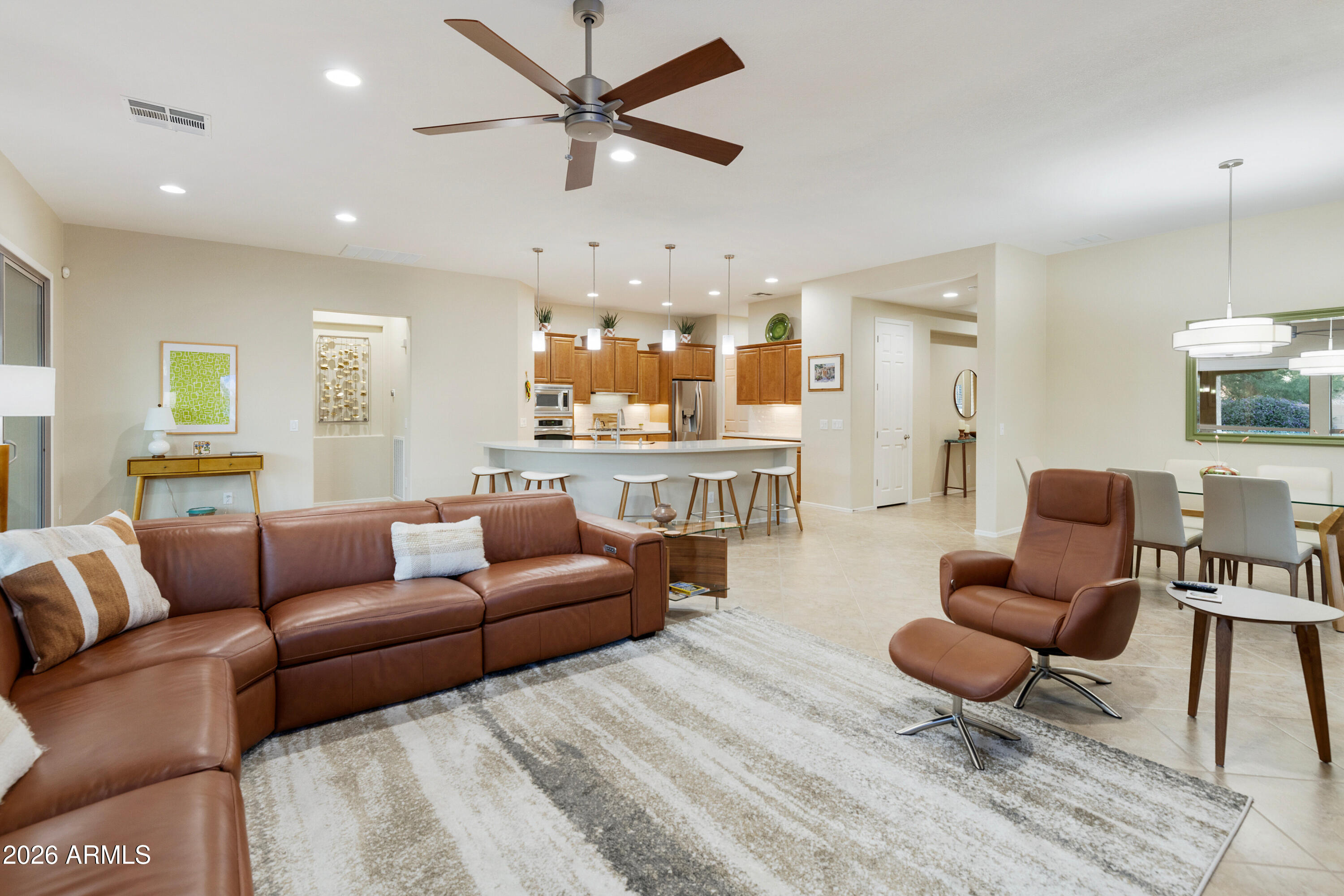 5291 South Sugarberry Court Gilbert, AZ 85298 - Photo 19 of 67 a living room with furniture and a view of kitchen